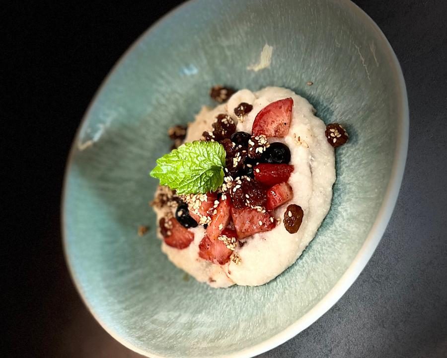 An ayurvedic breakfast bowl with berries and mint